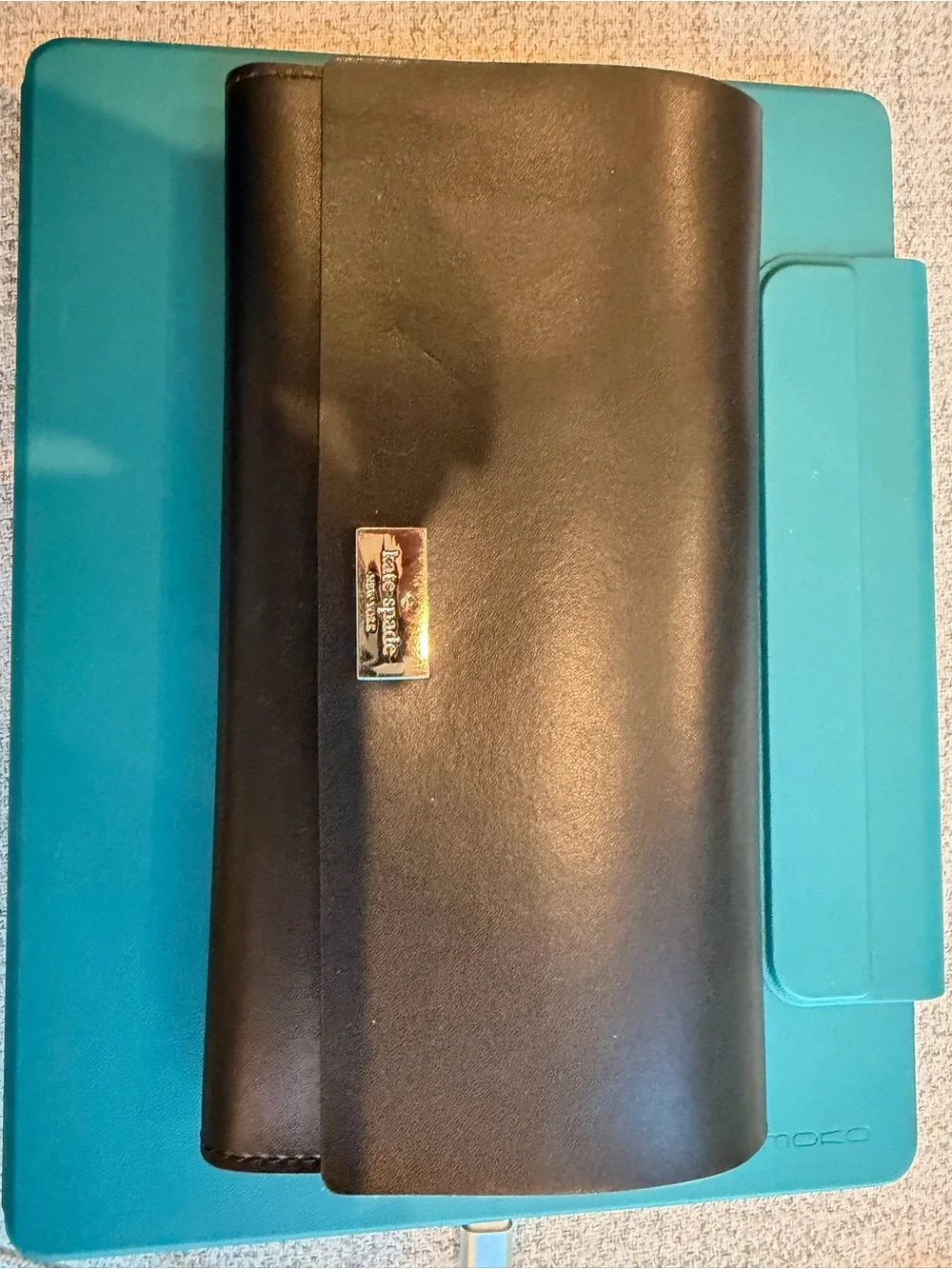 Kate Spade black billfold.